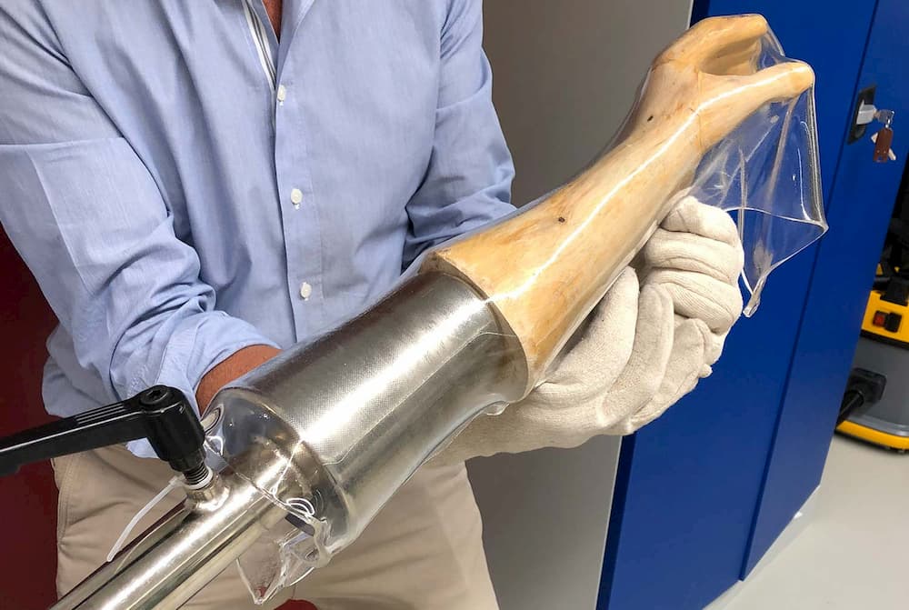 Drape-forming a high-temperature orthosis on a wooden model of a hand