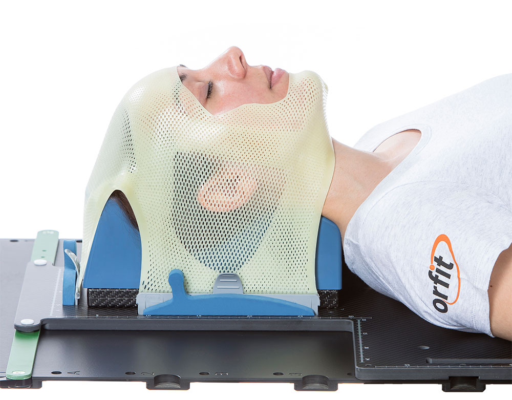 Radiotherapy patient immobilized with a thermoplastic mask and head support