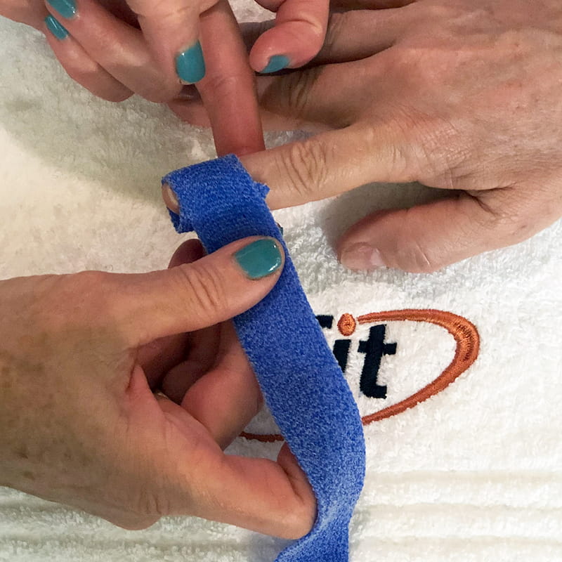 Wrapping Orficast around the patient's finger